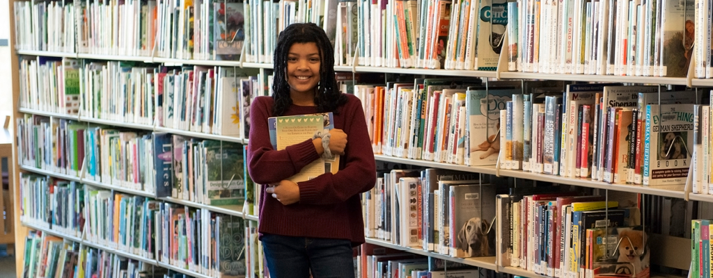 Girl Hugging Books