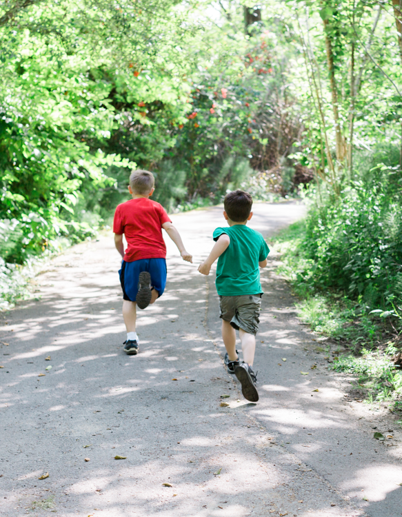 Children running on a trail