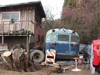 Junk, discards, vehicle parts and garbage, in yard