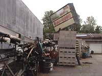 Leaning stack of concrete blocks and a large sign