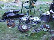 Vehicle parts and junk stored outside